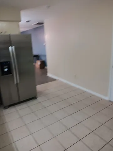 a view of a hallway with staircase