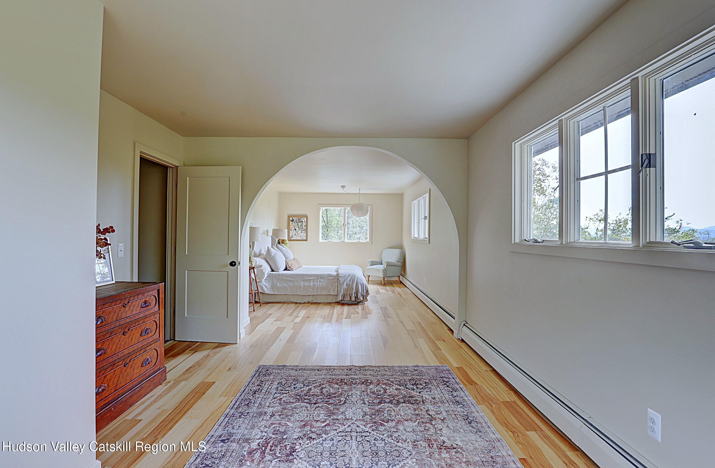 96 Echo Hill Road Saugerties, NY 12477 - Photo 17 of 32 a living room with furniture and a rug