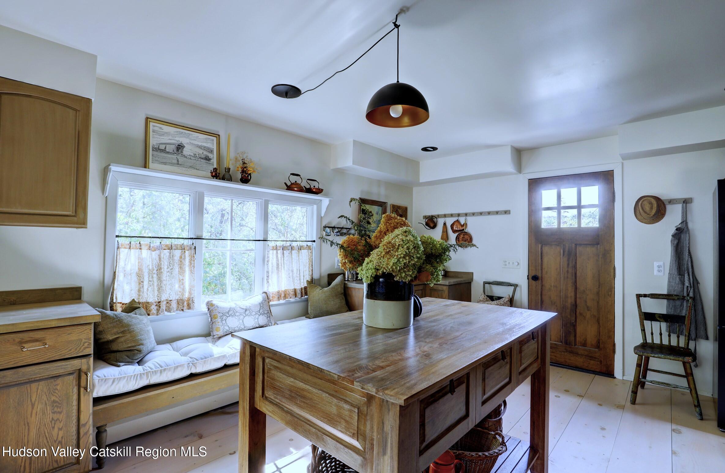 96 Echo Hill Road Saugerties, NY 12477 - Photo 5 of 32 a view of a dining room with furniture and a chandelier