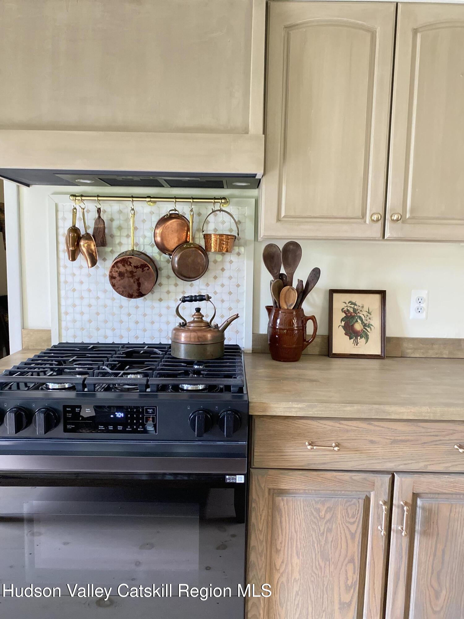 96 Echo Hill Road Saugerties, NY 12477 - Photo 6 of 32 a kitchen with a stove and cabinets