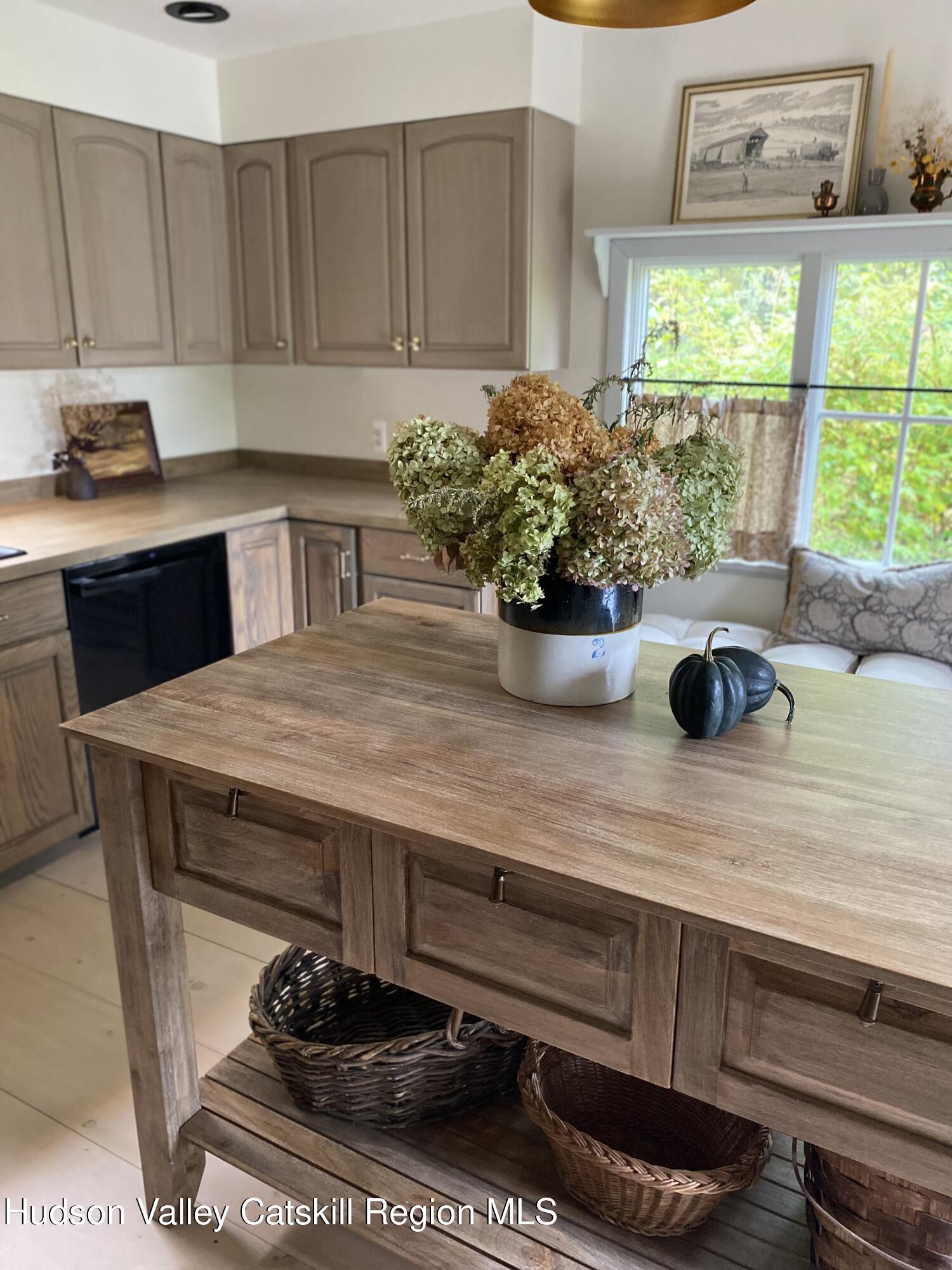 96 Echo Hill Road Saugerties, NY 12477 - Photo 7 of 32 a kitchen with a stove a sink and a window