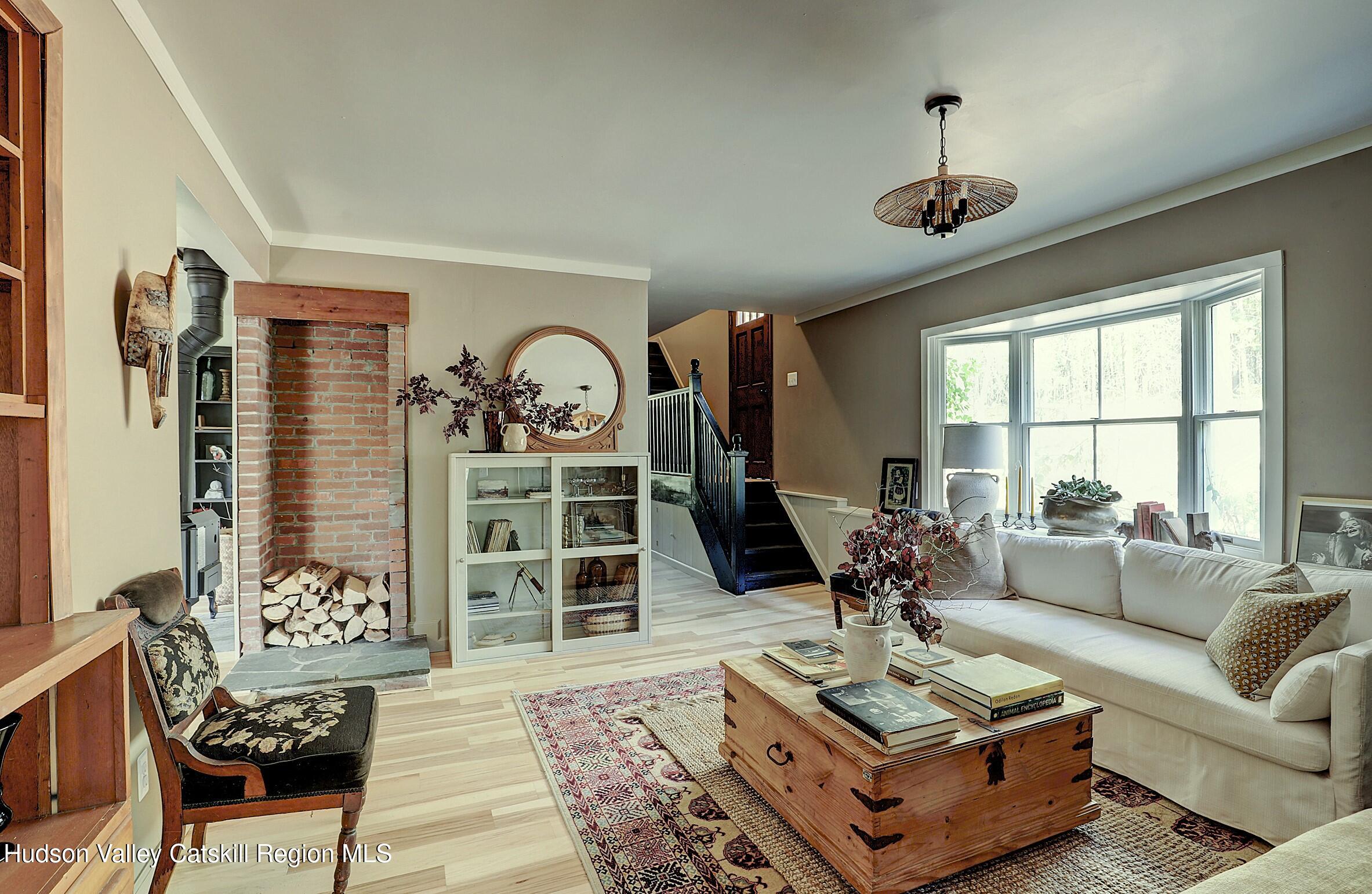 96 Echo Hill Road Saugerties, NY 12477 - Photo 10 of 32 a living room with furniture and a large window