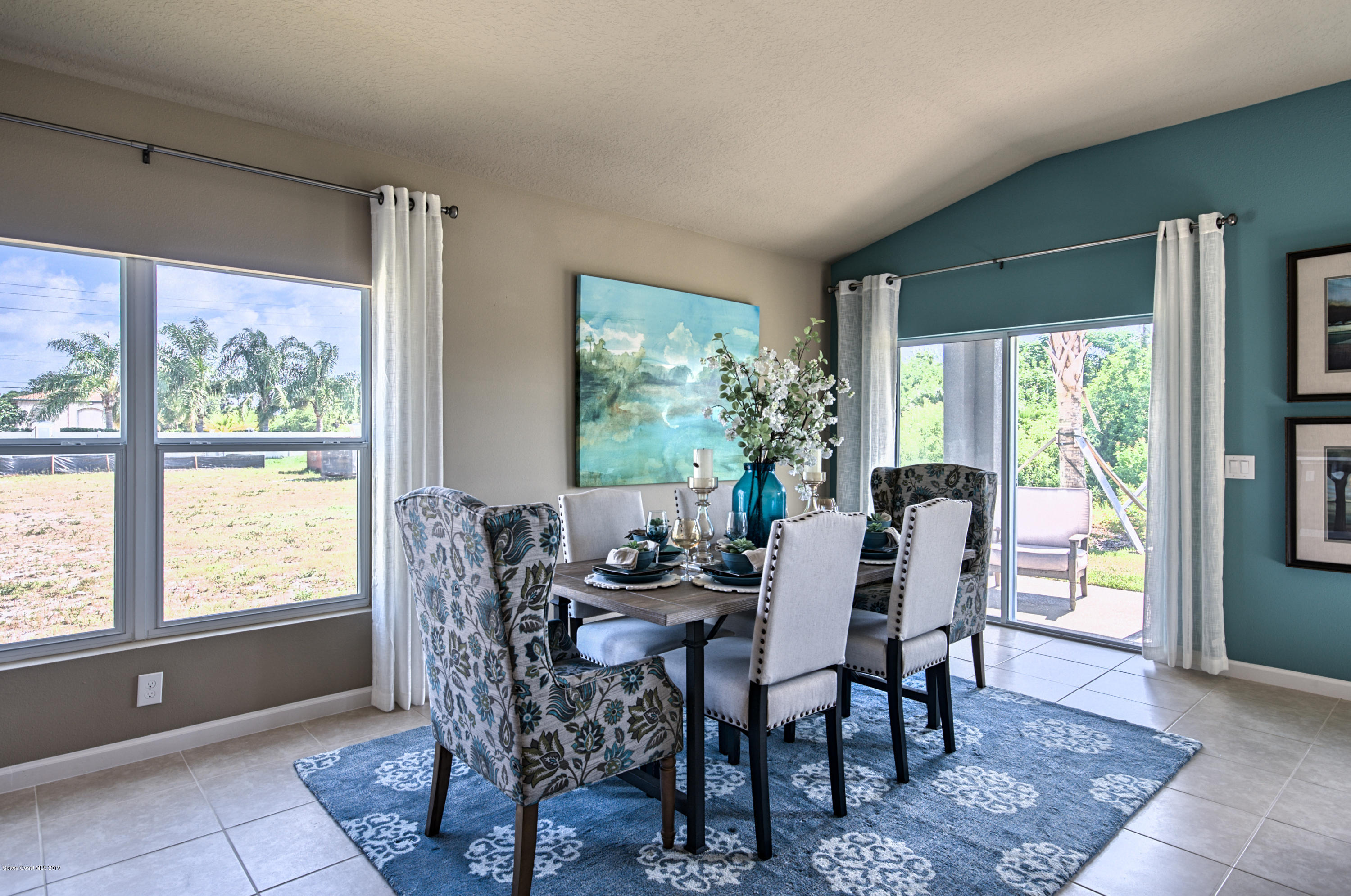 1027 Corbin Circle Southwest Palm Bay, FL 32908 - Photo 5 of 11 a dining room with furniture and window