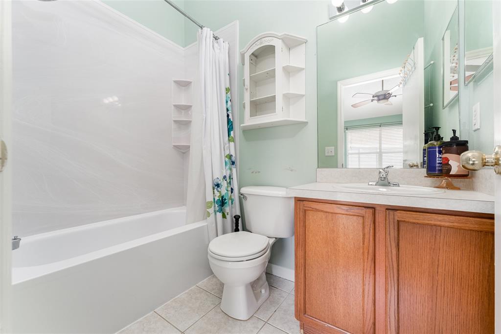 10423 Heron Lake Drive Riverview, FL 33578 - Photo 14 of 30 a bathroom with a granite countertop sink toilet and shower