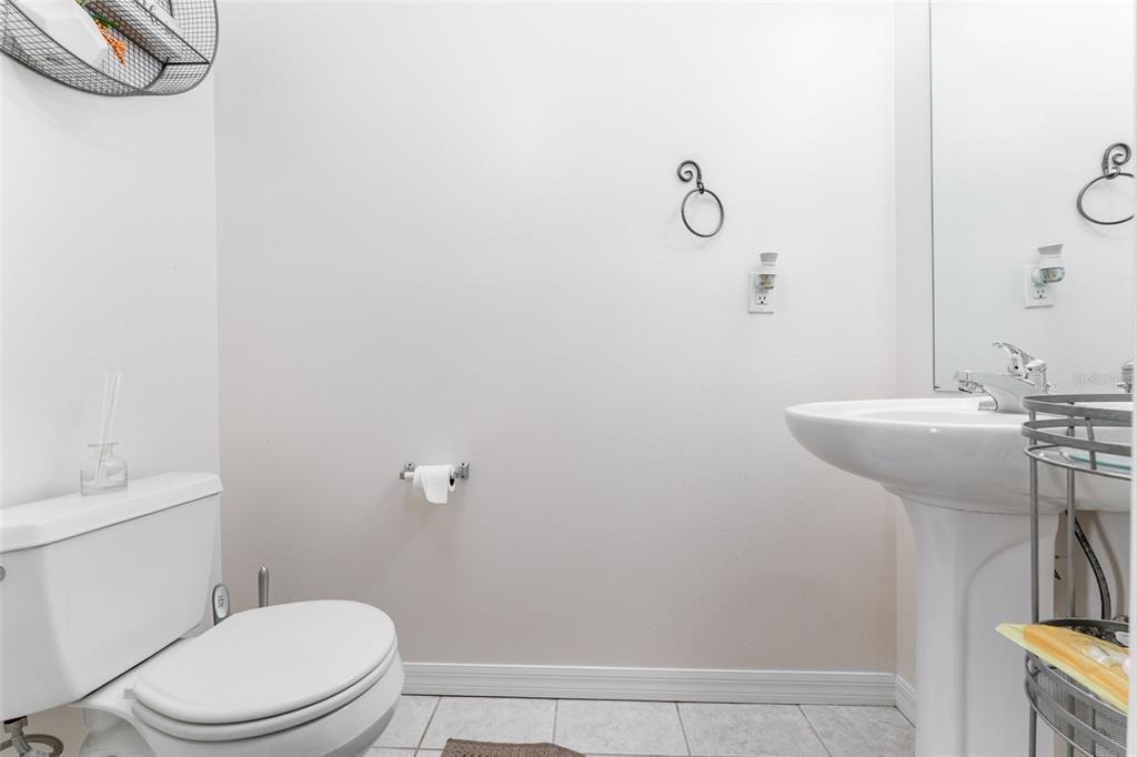 10423 Heron Lake Drive Riverview, FL 33578 - Photo 16 of 30 a bathroom with a toilet a sink and mirror