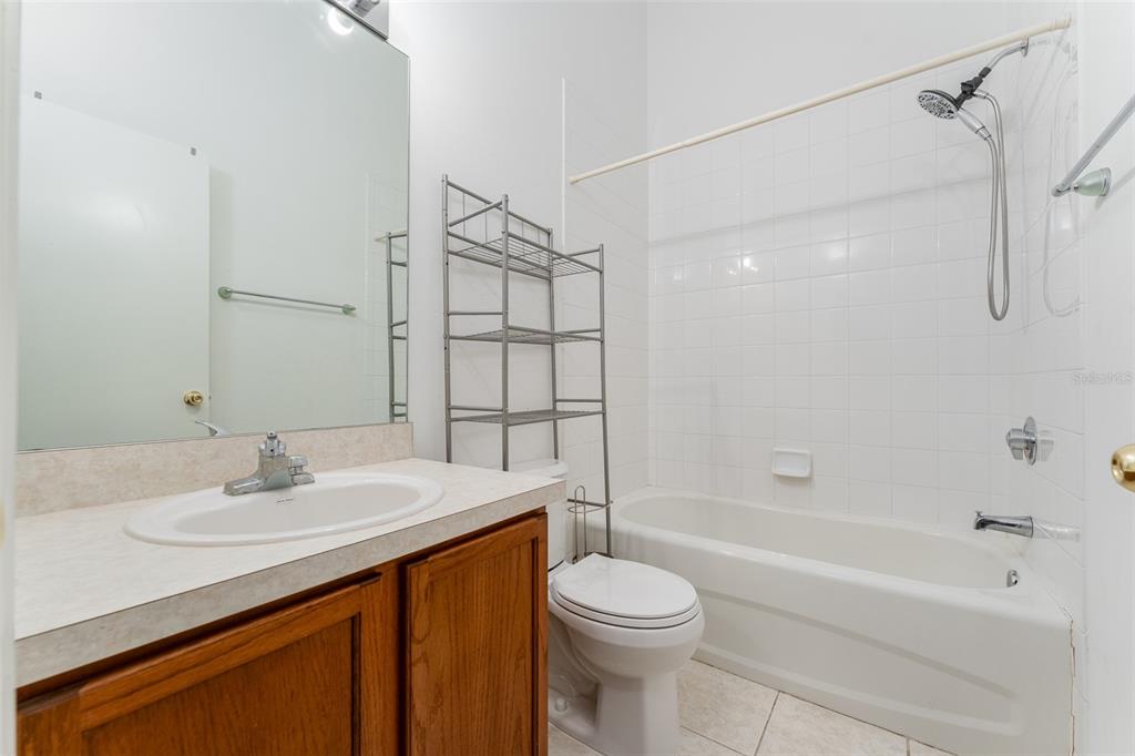 10423 Heron Lake Drive Riverview, FL 33578 - Photo 17 of 30 a bathroom with a sink a toilet and shower