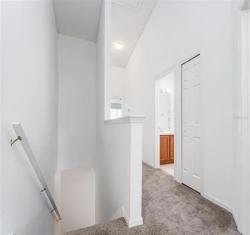 a view of staircase with white walls