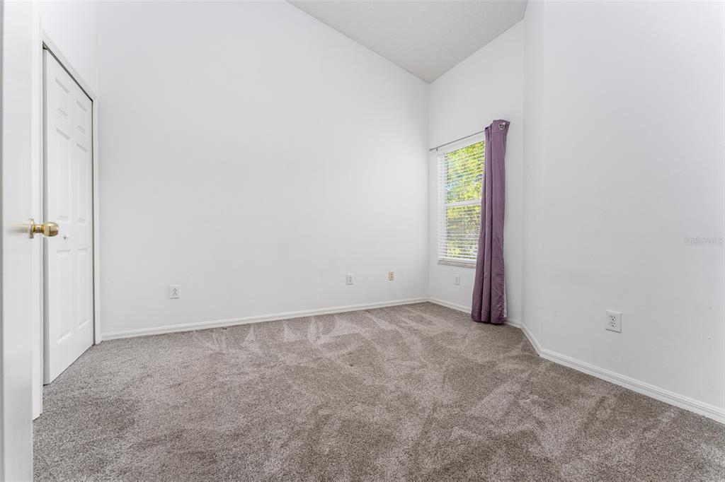 10423 Heron Lake Drive Riverview, FL 33578 - Photo 24 of 30 an empty room with windows