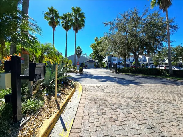 a view of a house with swimming pool and a yard