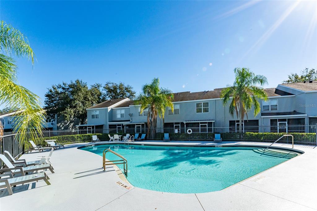 10423 Heron Lake Drive Riverview, FL 33578 - Photo 28 of 30 a view of a house with swimming pool and a yard