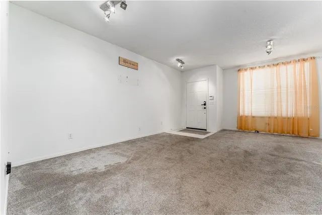 an empty room with windows