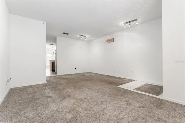 a kitchen with kitchen island granite countertop a sink counter top space appliances and cabinets