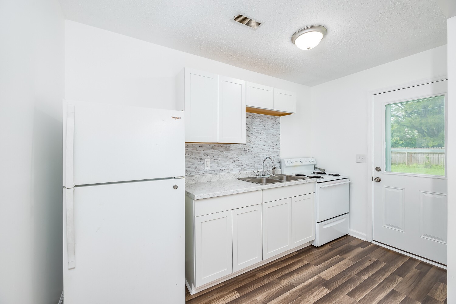 303 Burch Road Clarksville, TN 37042 - Photo 1 of 23 a kitchen with sink cabinets and a refrigerator