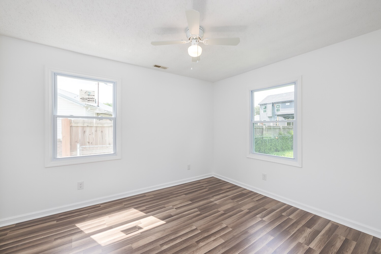 303 Burch Road Clarksville, TN 37042 - Photo 16 of 23 an empty room with wooden floor and windows