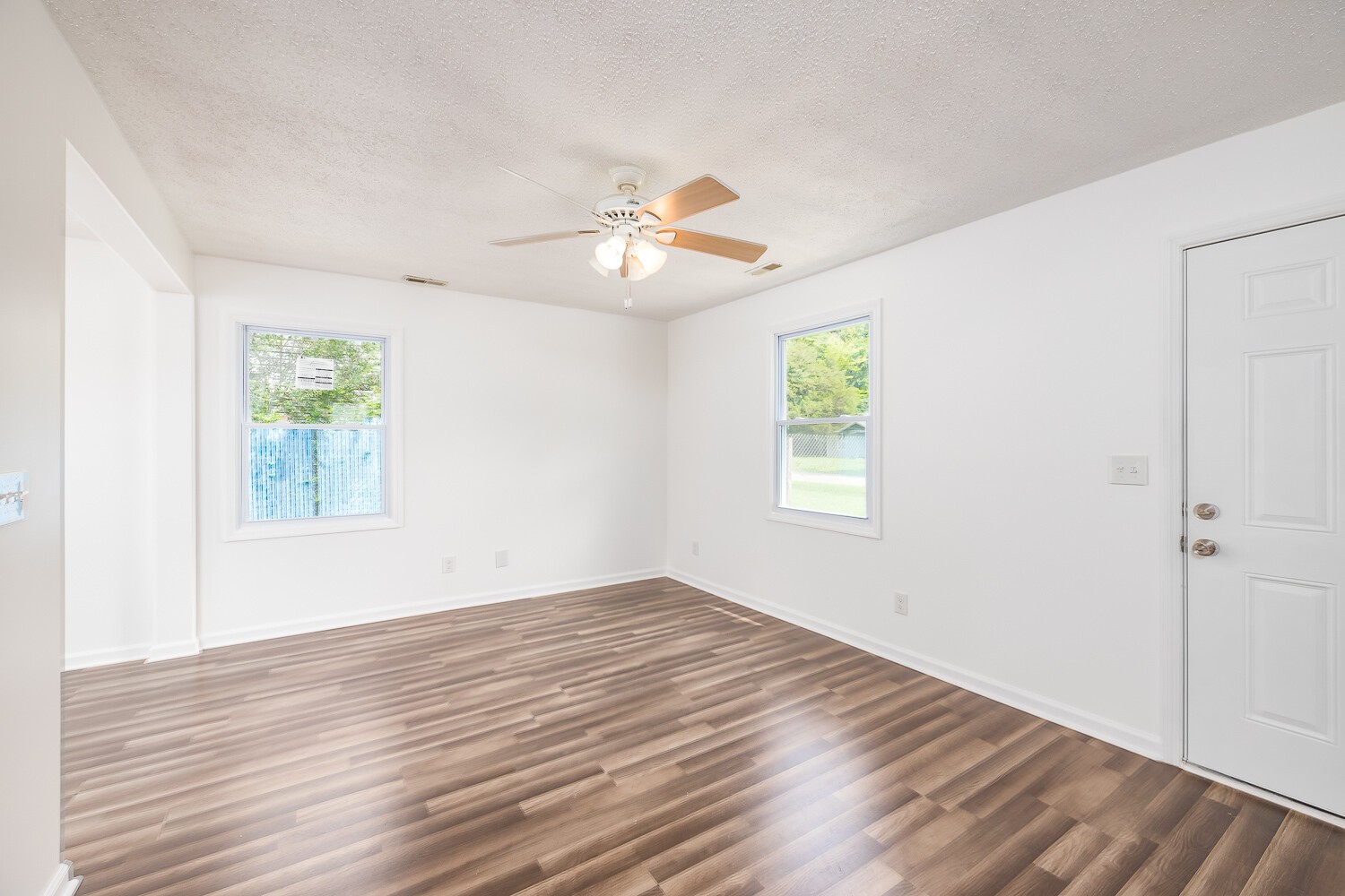 303 Burch Road Clarksville, TN 37042 - Photo 2 of 23 a view of empty room with wooden floor and fan