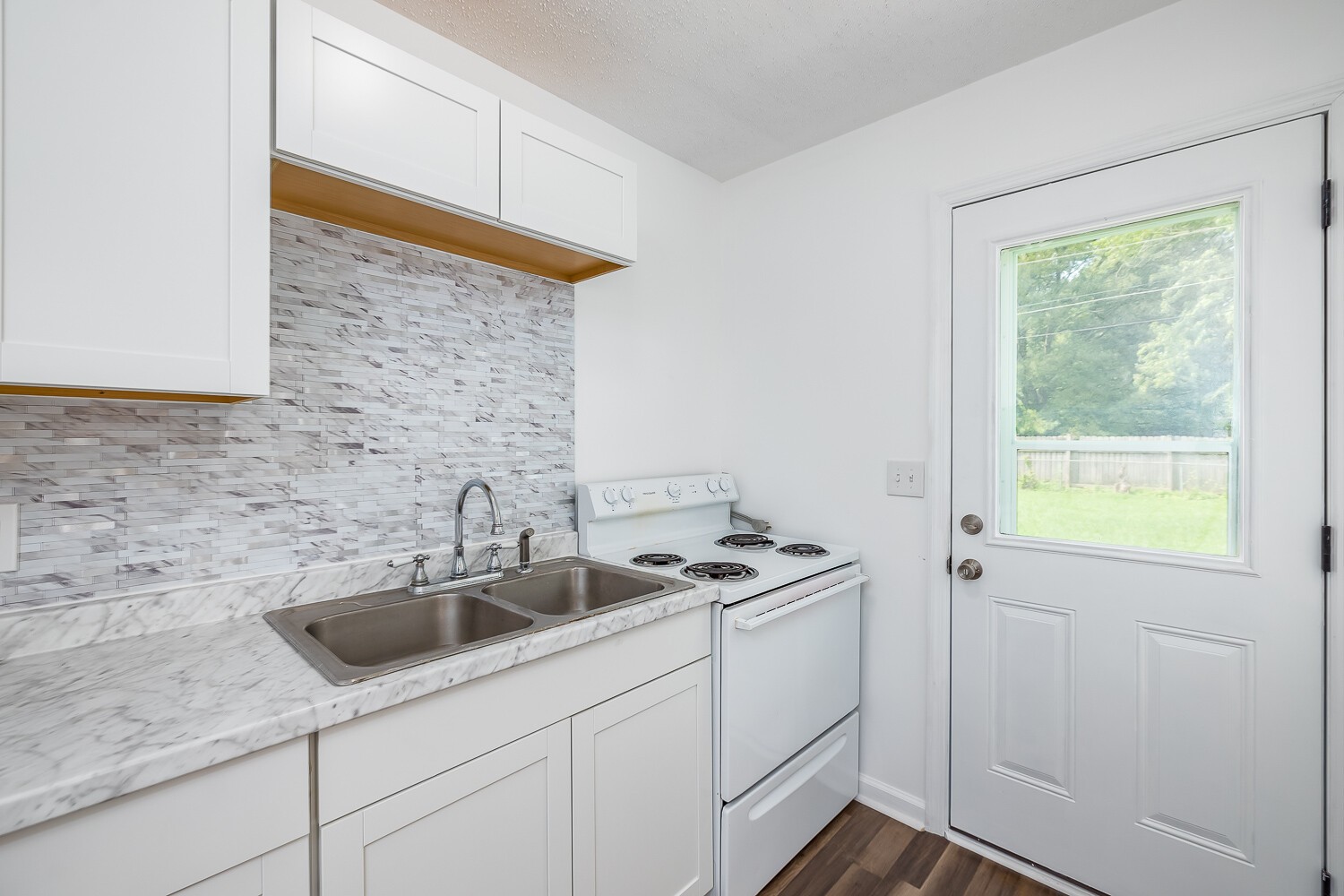 303 Burch Road Clarksville, TN 37042 - Photo 9 of 23 a kitchen with a sink and cabinets