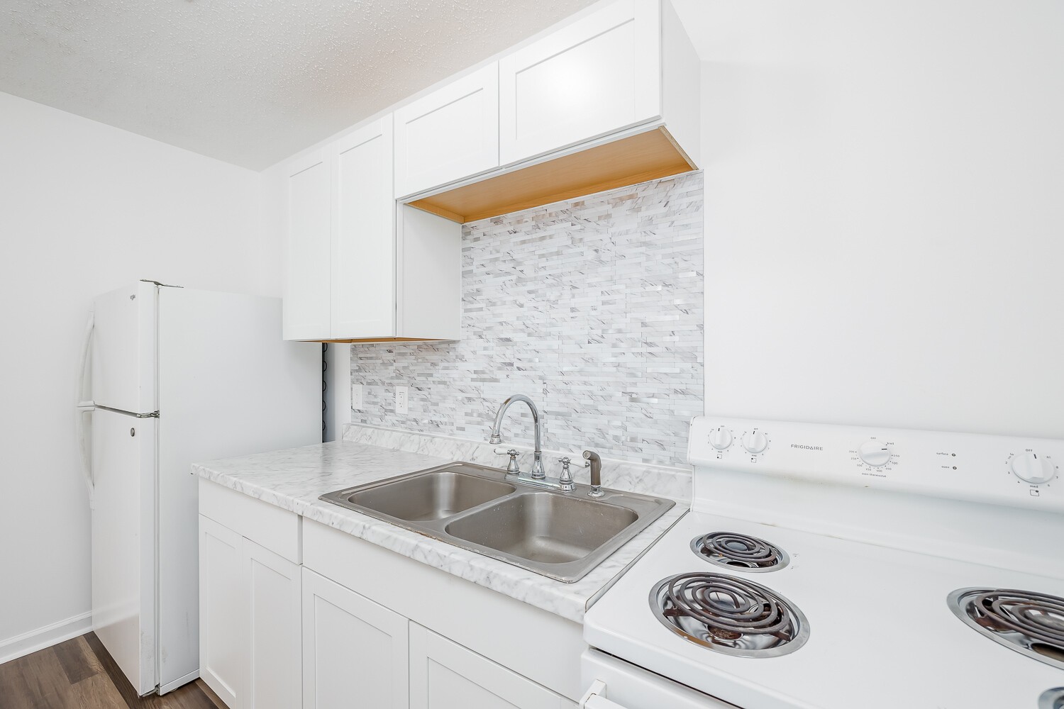 303 Burch Road Clarksville, TN 37042 - Photo 10 of 23 a kitchen with a sink and a refrigerator