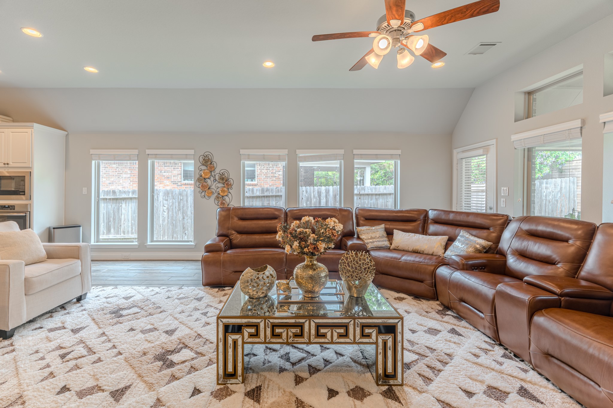 209 Trillium Park Loop Conroe, TX 77304 - Photo 19 of 50 a living room with furniture a chandelier and a rug