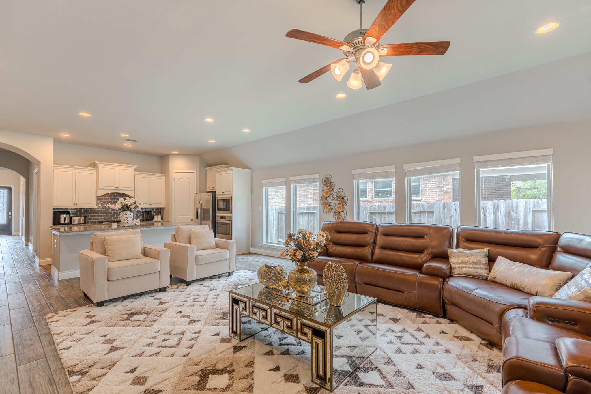 209 Trillium Park Loop Conroe, TX 77304 - Photo 20 of 50 a living room with furniture ceiling fan and a rug