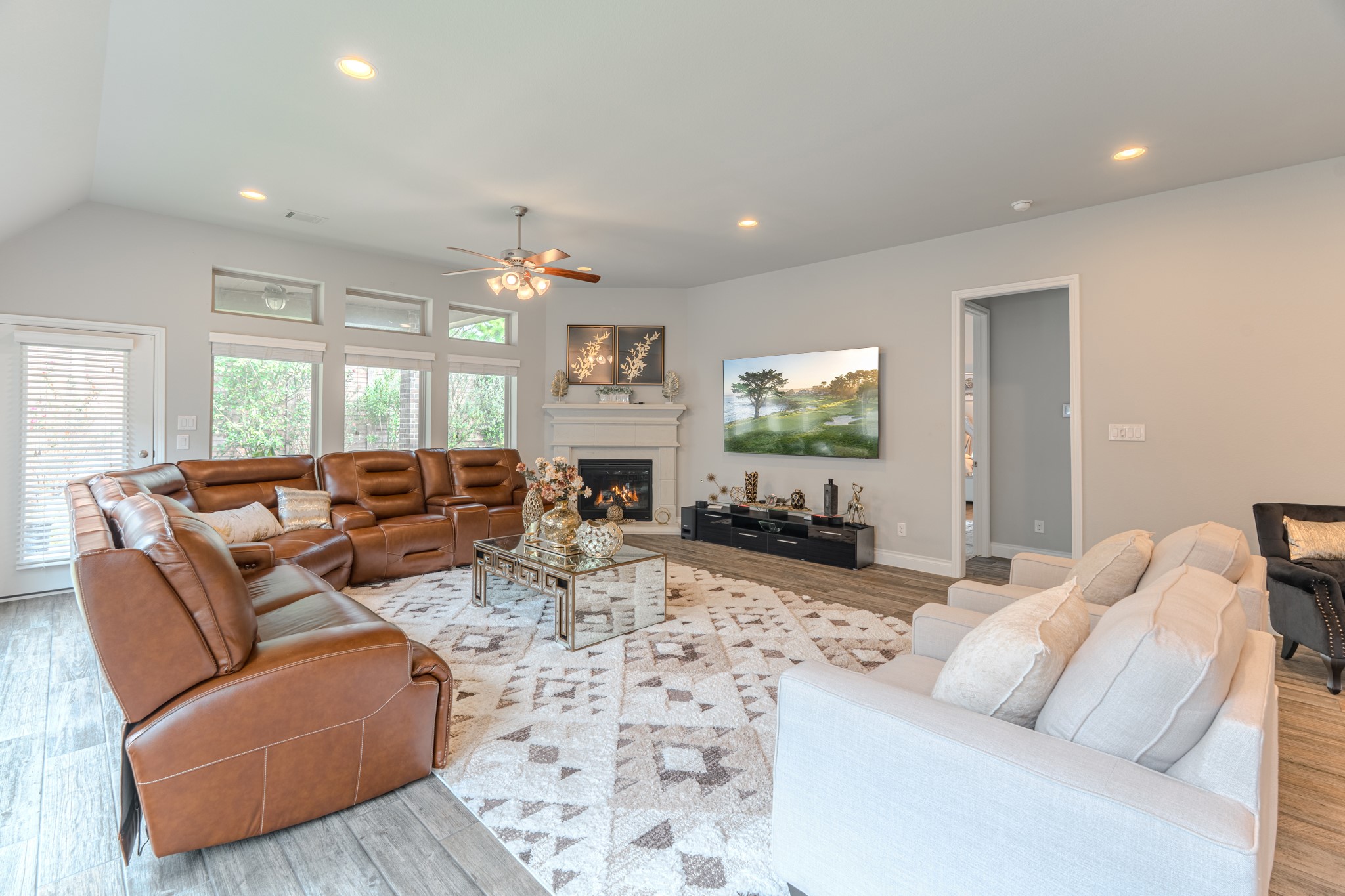 209 Trillium Park Loop Conroe, TX 77304 - Photo 24 of 50 a living room with furniture and a flat screen tv