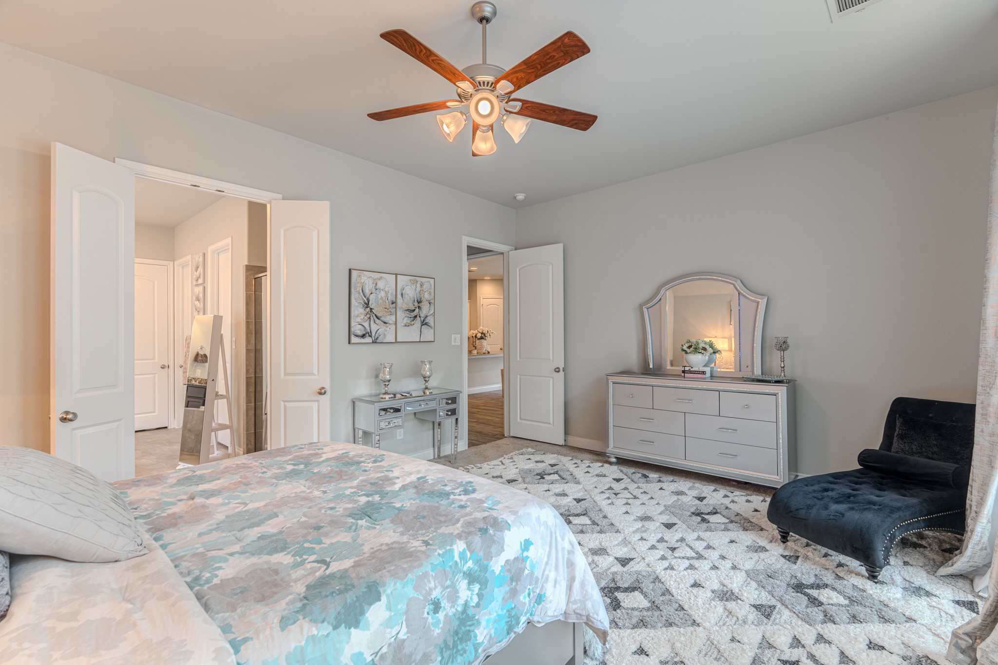 209 Trillium Park Loop Conroe, TX 77304 - Photo 27 of 50 a bedroom with a bed and a dresser