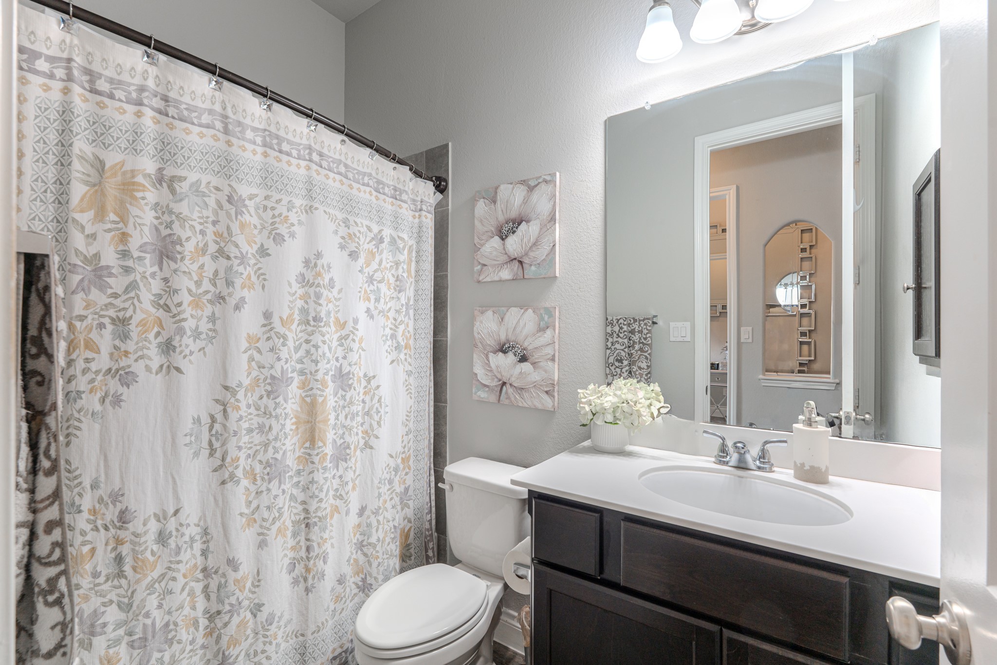 209 Trillium Park Loop Conroe, TX 77304 - Photo 33 of 50 a bathroom with a sink vanity mirror and toilet