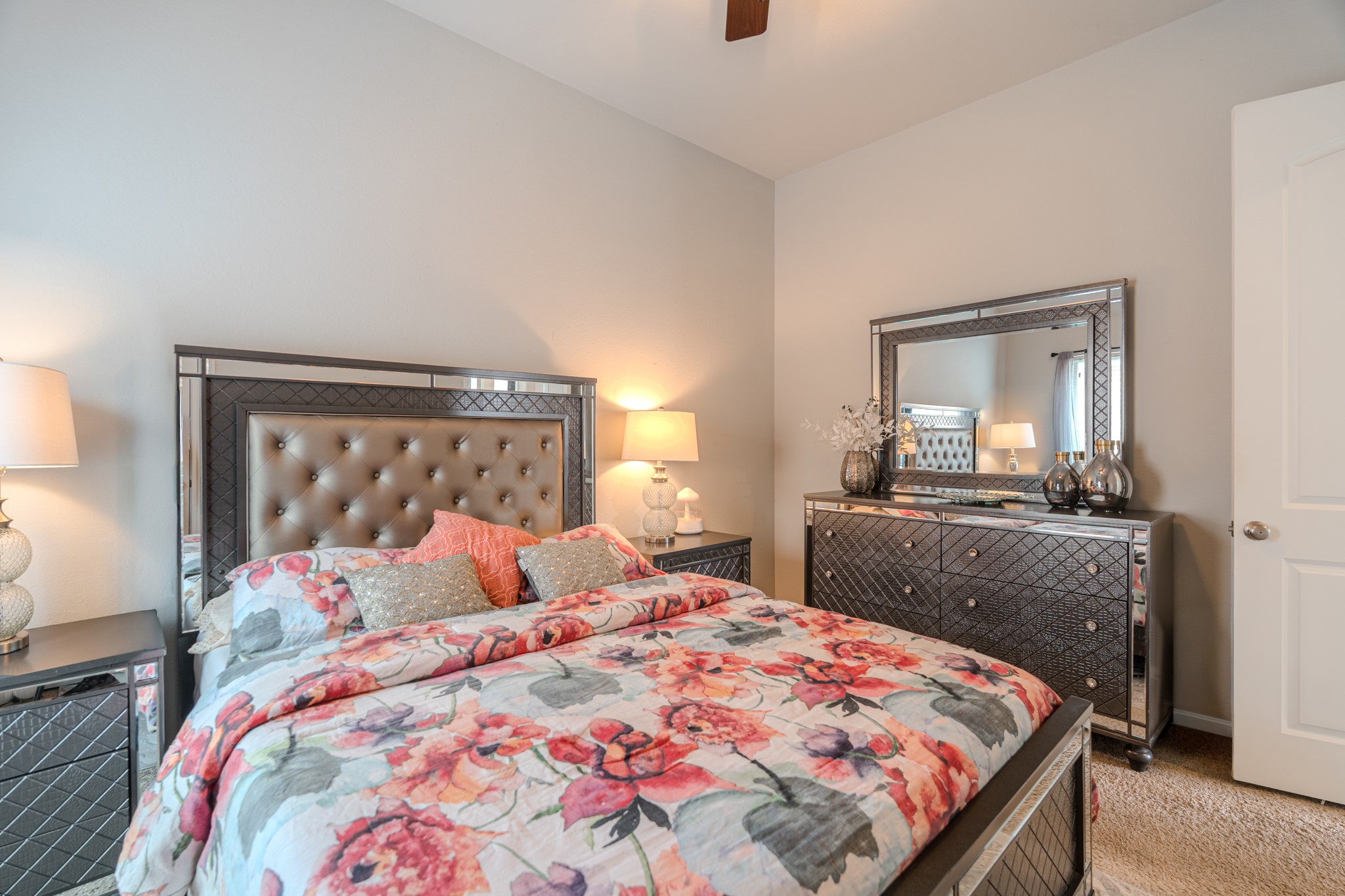 209 Trillium Park Loop Conroe, TX 77304 - Photo 34 of 50 a bedroom with a bed and a mirror