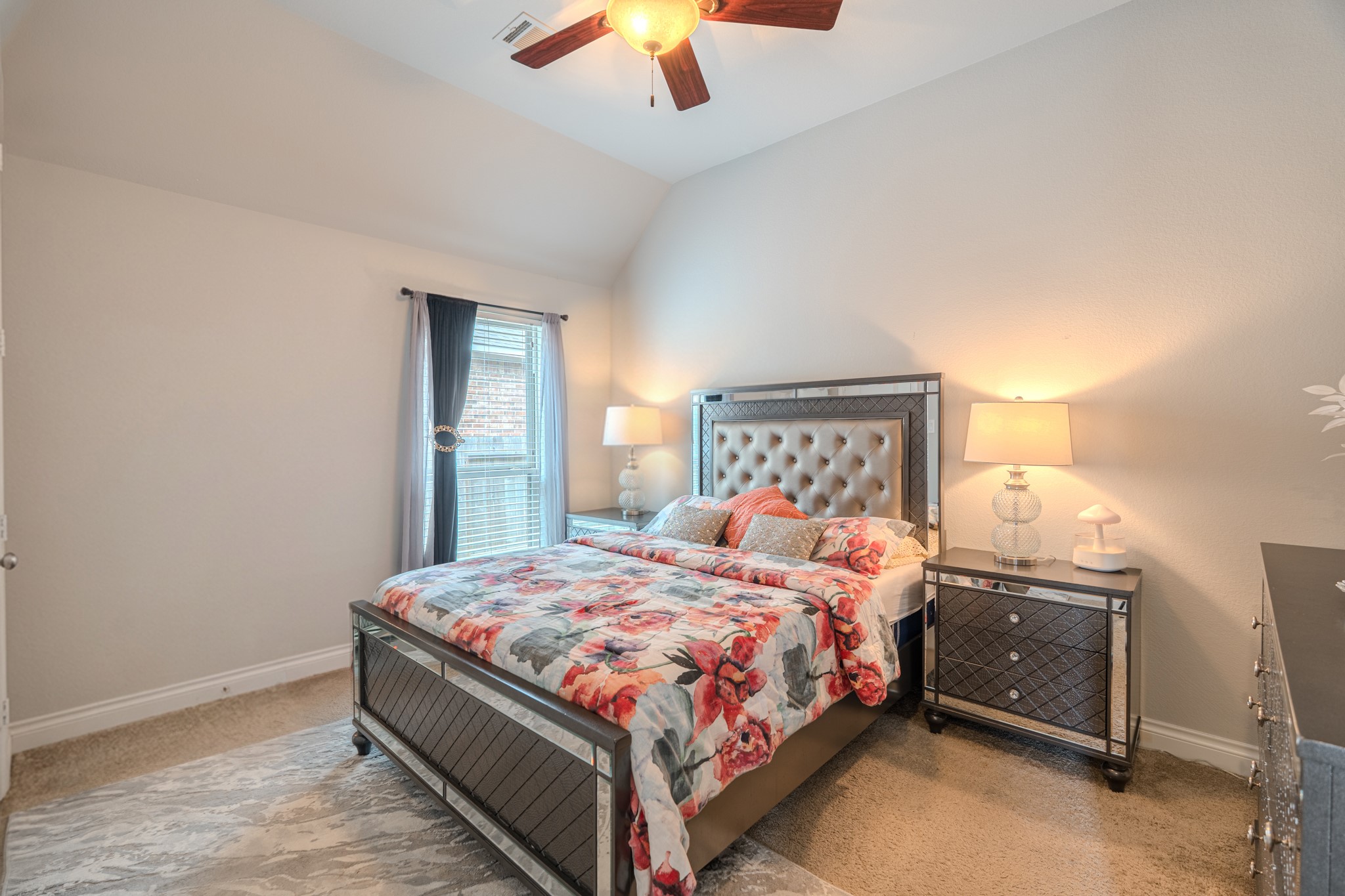 209 Trillium Park Loop Conroe, TX 77304 - Photo 35 of 50 a bedroom with a bed and a chandelier