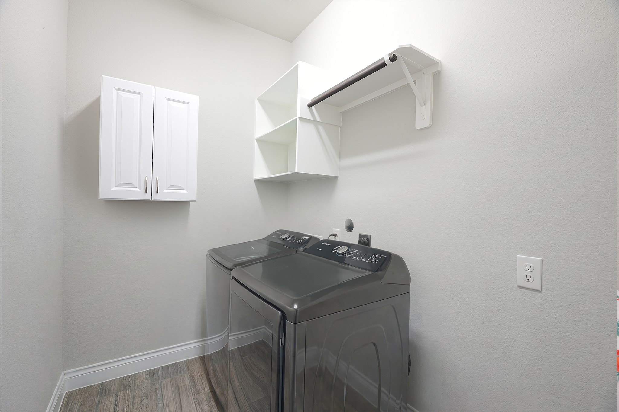 209 Trillium Park Loop Conroe, TX 77304 - Photo 36 of 50 a kitchen with a sink cabinets and stove