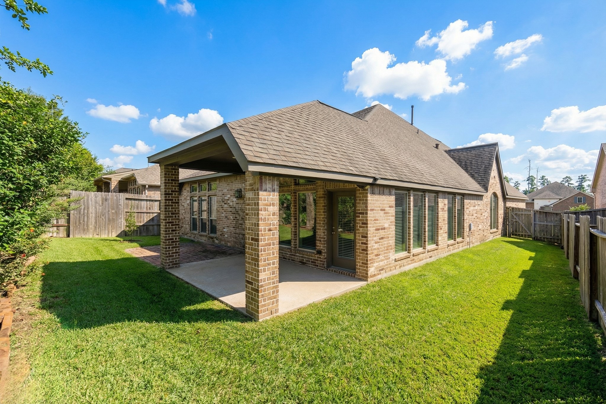 209 Trillium Park Loop Conroe, TX 77304 - Photo 38 of 50 a view of a house with a yard porch and sitting area