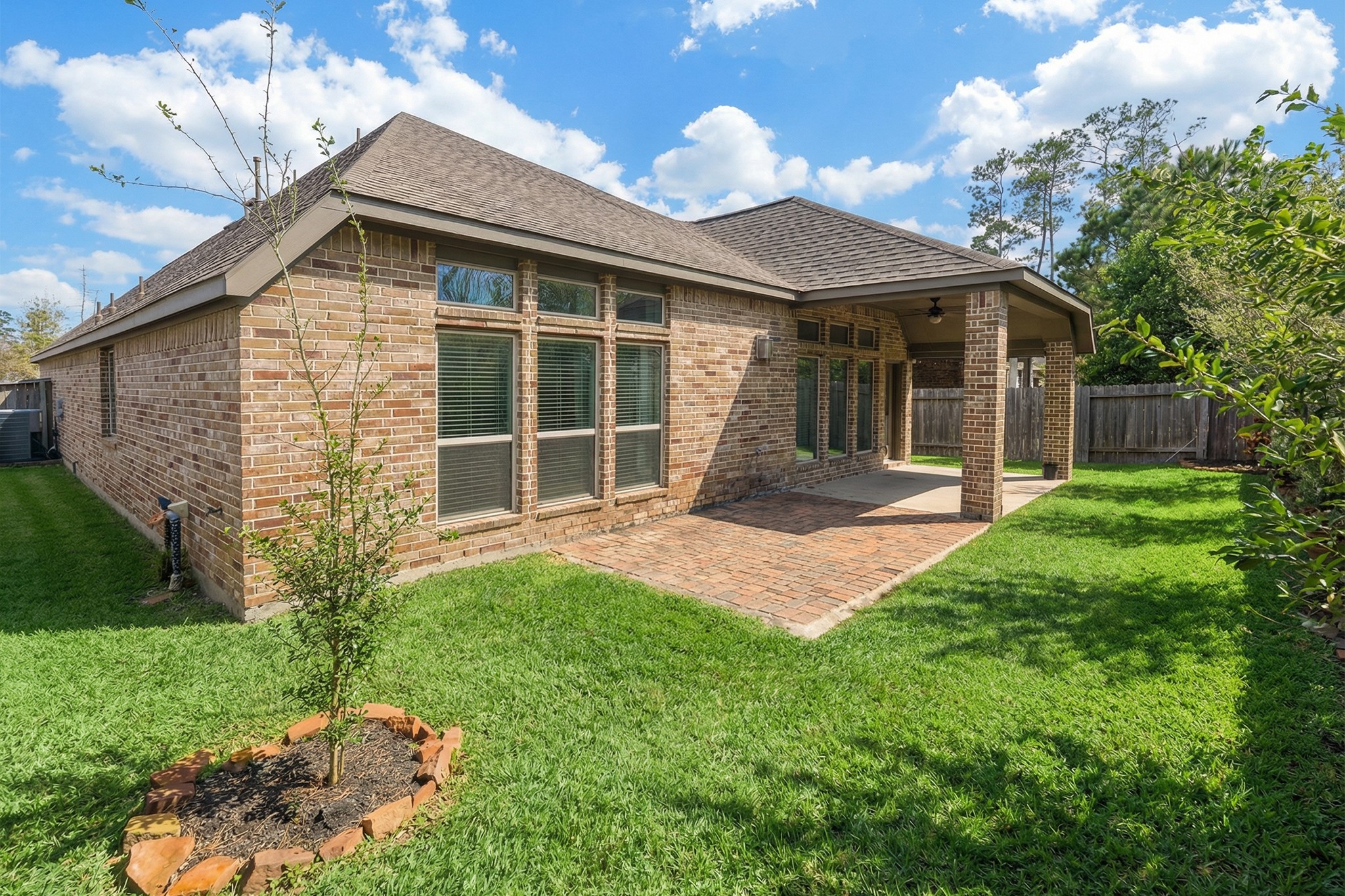 209 Trillium Park Loop Conroe, TX 77304 - Photo 39 of 50 a front view of a house with a yard and porch