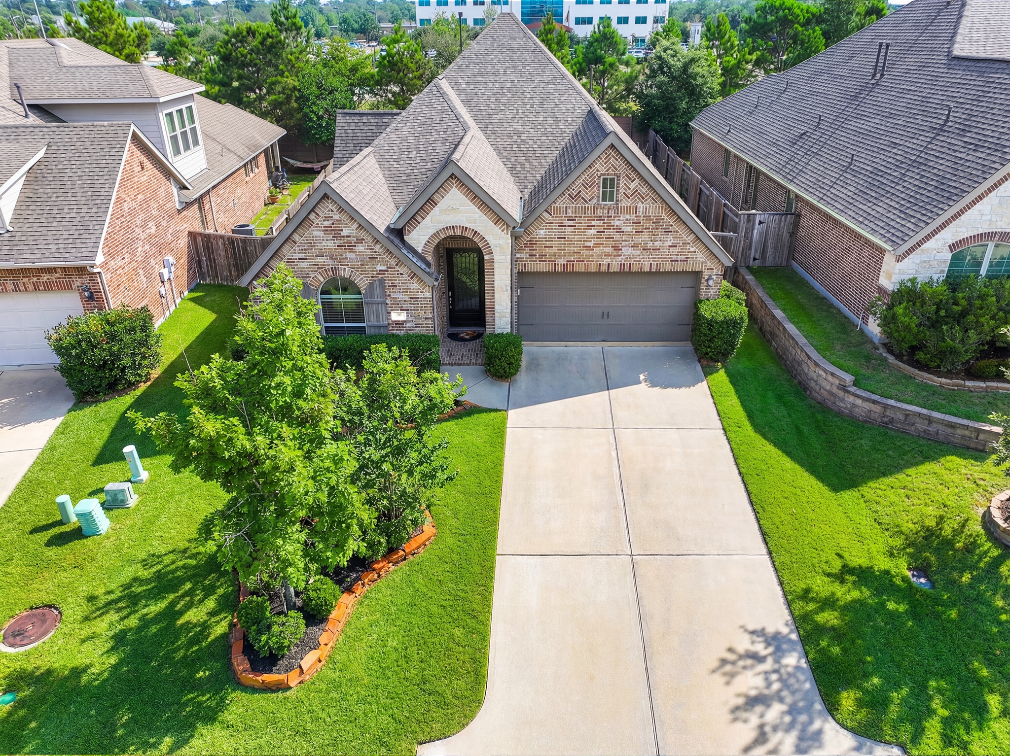 209 Trillium Park Loop Conroe, TX 77304 - Photo 4 of 50 front view of house with a yard and potted plants
