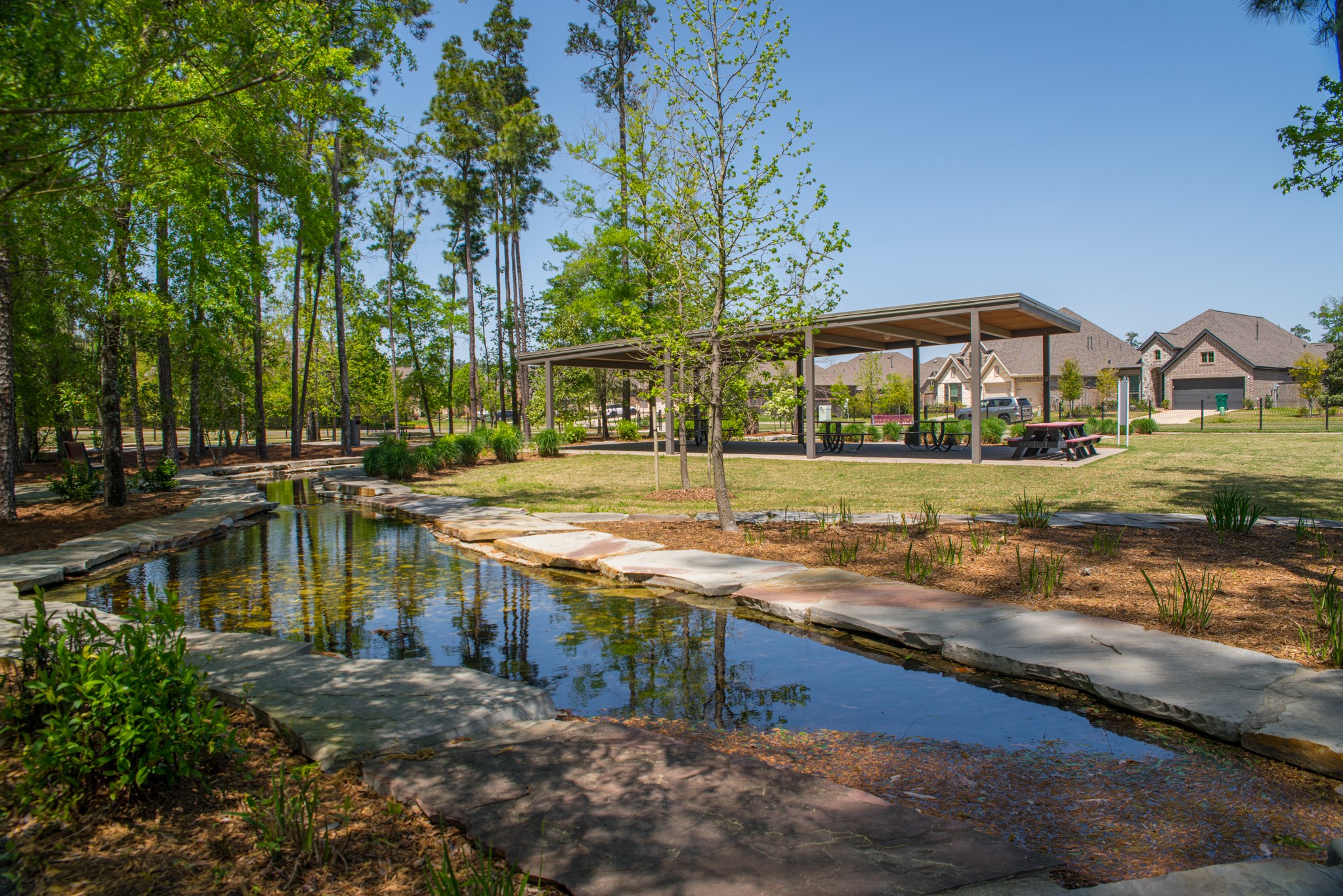 209 Trillium Park Loop Conroe, TX 77304 - Photo 46 of 50 a view of a house with a yard and sitting area