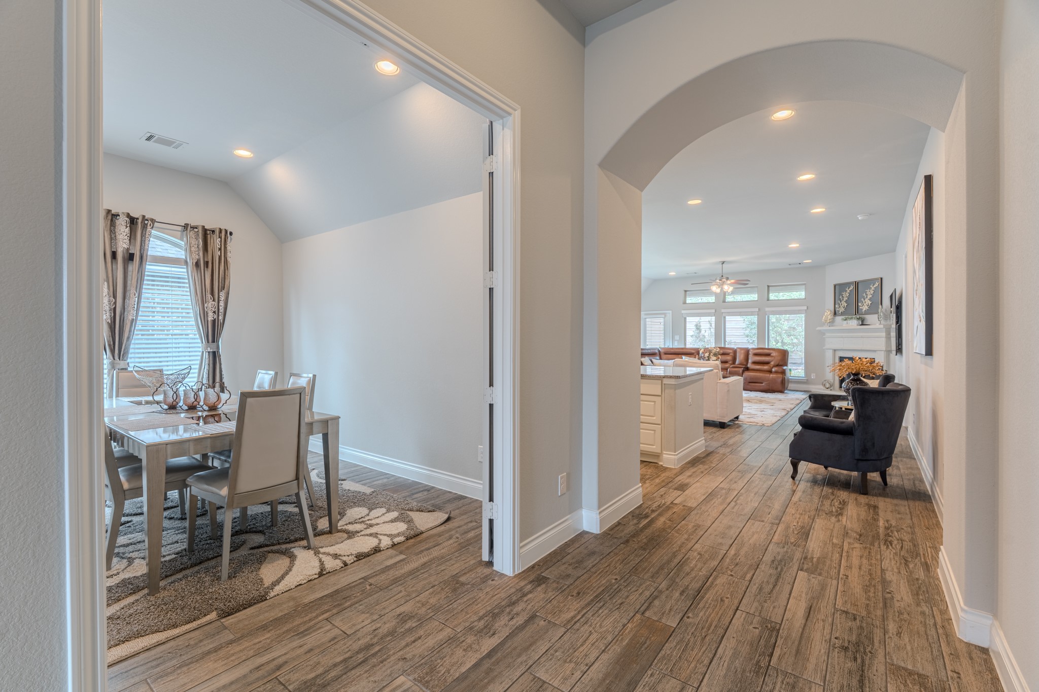 209 Trillium Park Loop Conroe, TX 77304 - Photo 9 of 50 a view of a dining room with furniture a rug and wooden floor