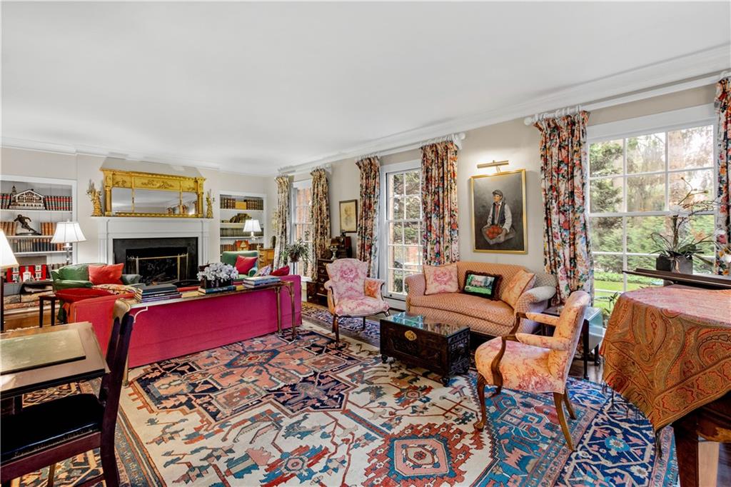 604 Poia Road Sewickley, PA 15143 - Photo 6 of 25 a living room with furniture a fireplace and a flat screen tv