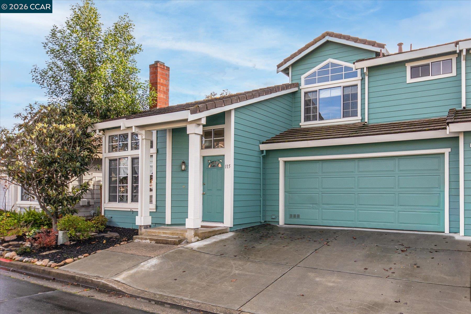 115 Cardoza Hercules, CA 94547 - Photo 1 of 1 a front view of a house with a yard and garage