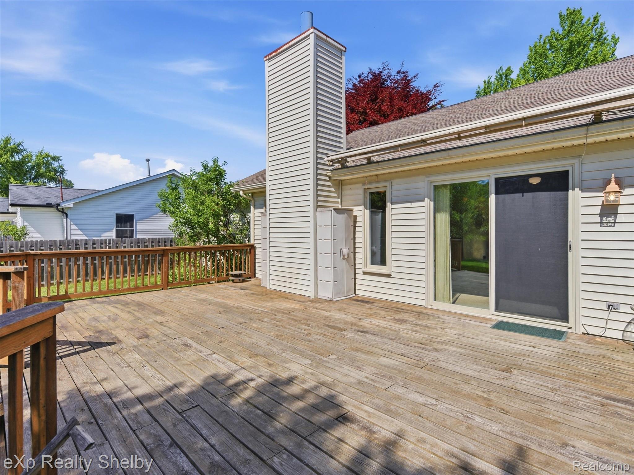 4154 Union Street Dryden, MI 48428 - Photo 38 of 41 Expansive wood deck with a full railing and privacy fencing