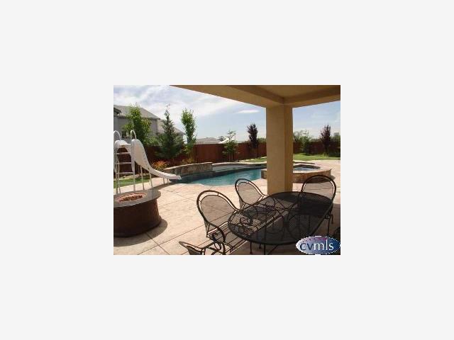 626 Lan Way Ripon, CA 95366 - Photo 11 of 12 a balcony with furniture and a potted plant