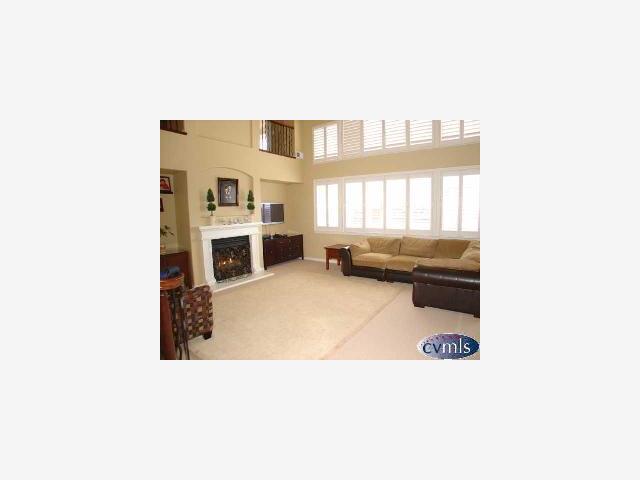 626 Lan Way Ripon, CA 95366 - Photo 3 of 12 a living room with furniture and a fireplace