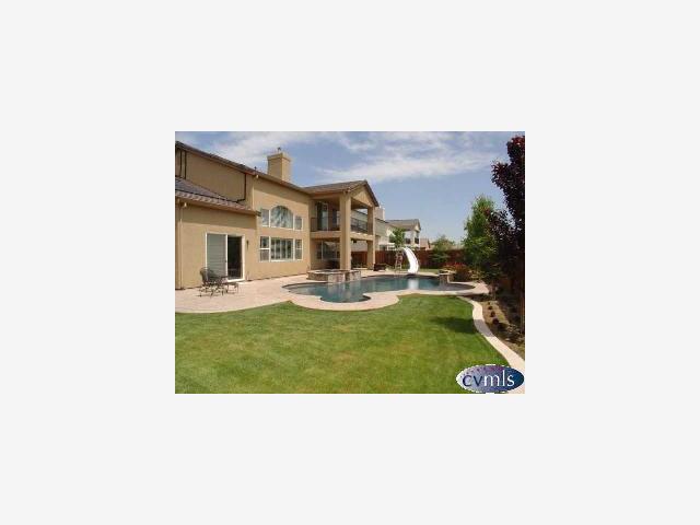 626 Lan Way Ripon, CA 95366 - Photo 9 of 12 a picture of a house with a backyard