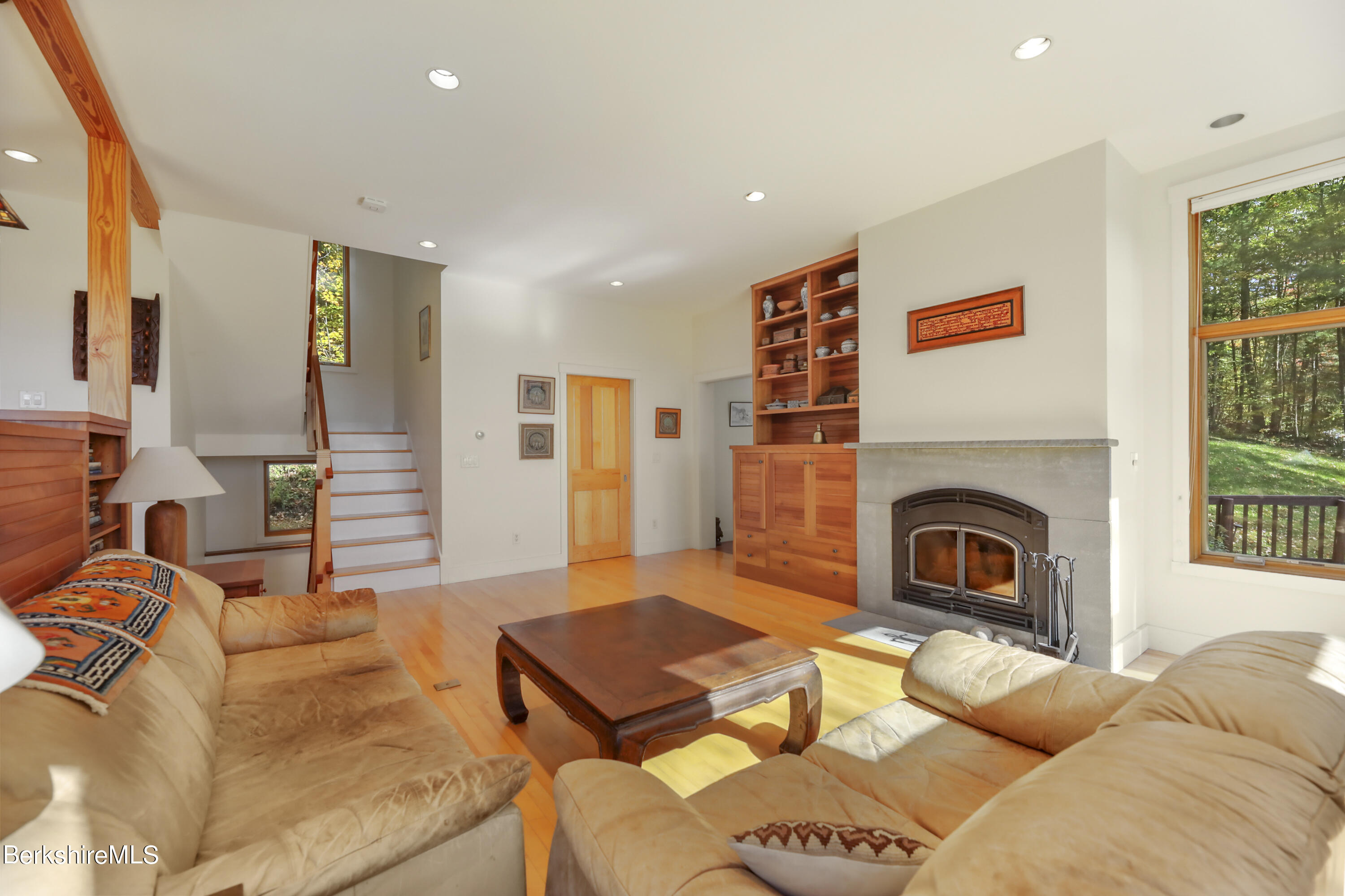 494 Dean Hill Road Richmond, MA 01254 - Photo 11 of 54 a living room with furniture a fireplace and a large window