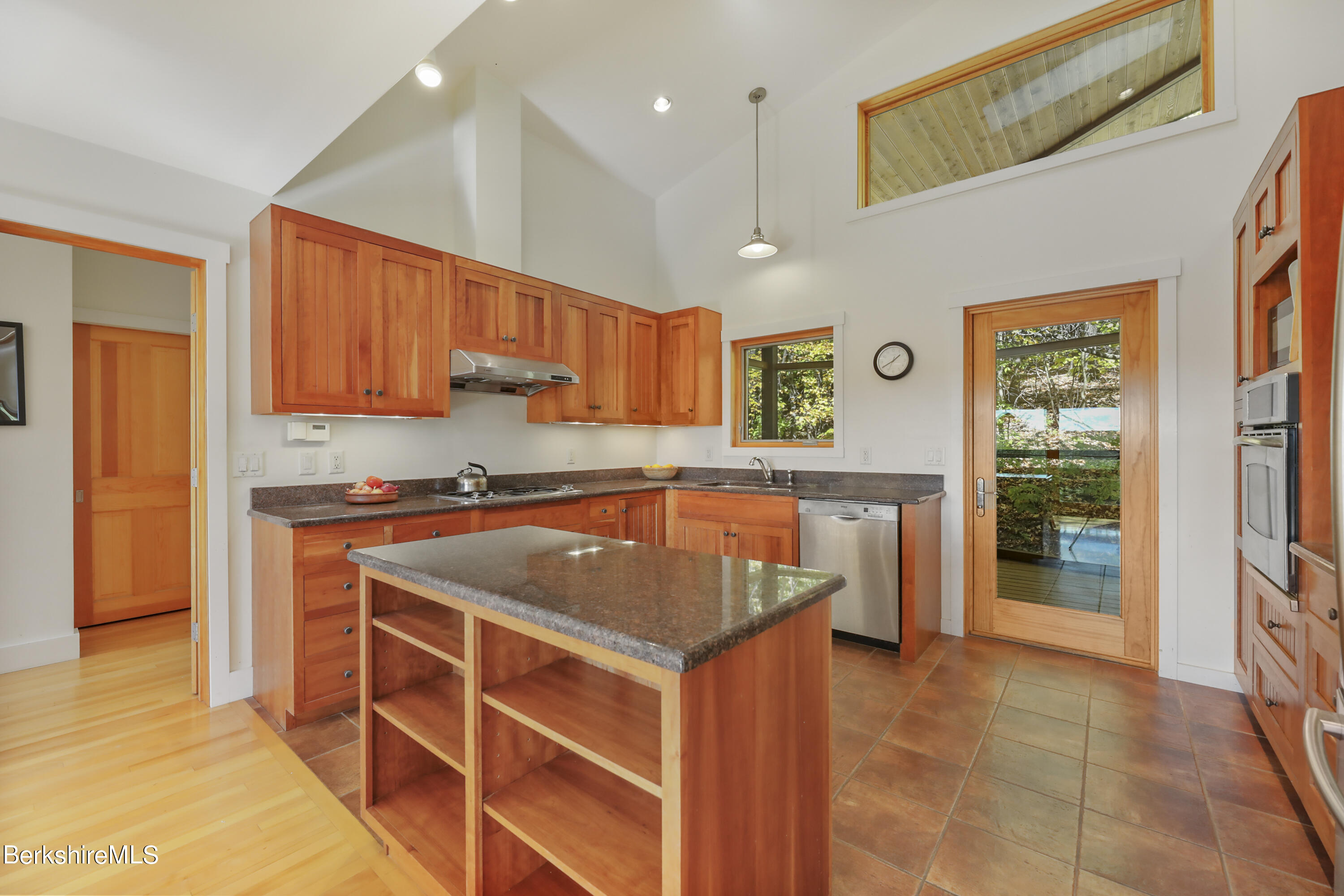 494 Dean Hill Road Richmond, MA 01254 - Photo 17 of 54 a kitchen with stainless steel appliances granite countertop a stove a sink and a refrigerator