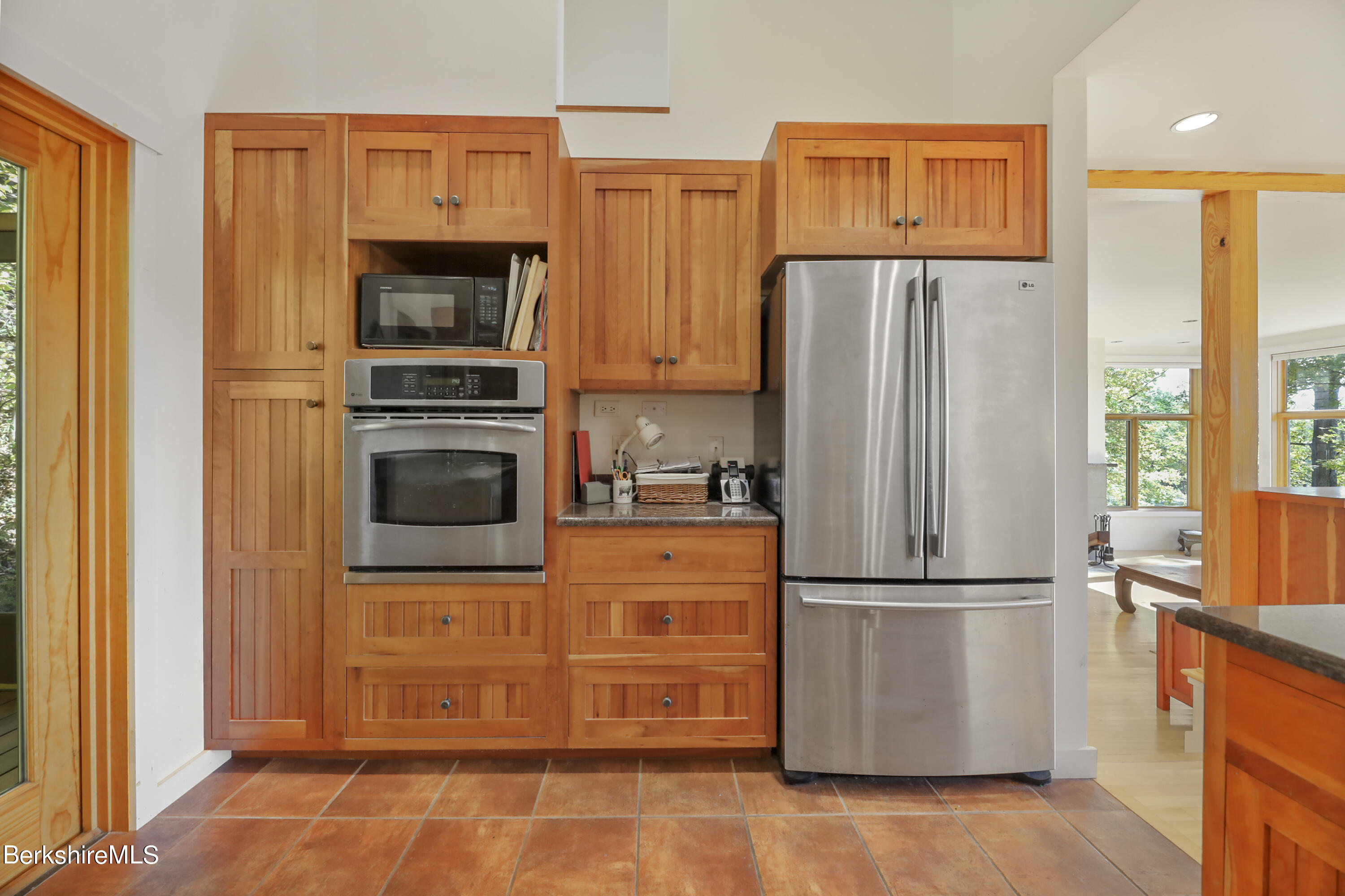 494 Dean Hill Road Richmond, MA 01254 - Photo 20 of 54 a kitchen with stainless steel appliances granite countertop a refrigerator microwave and stove