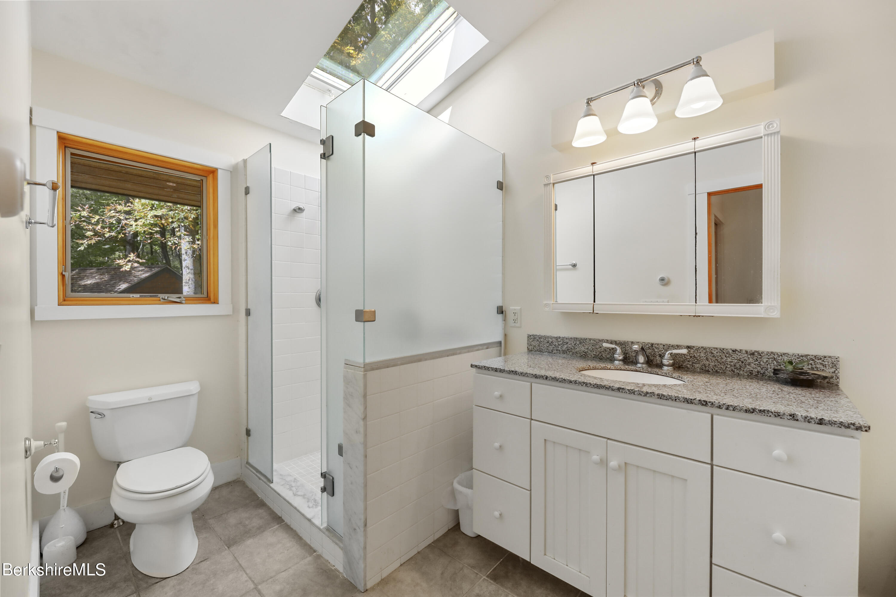 494 Dean Hill Road Richmond, MA 01254 - Photo 28 of 54 a bathroom with a toilet sink and mirror