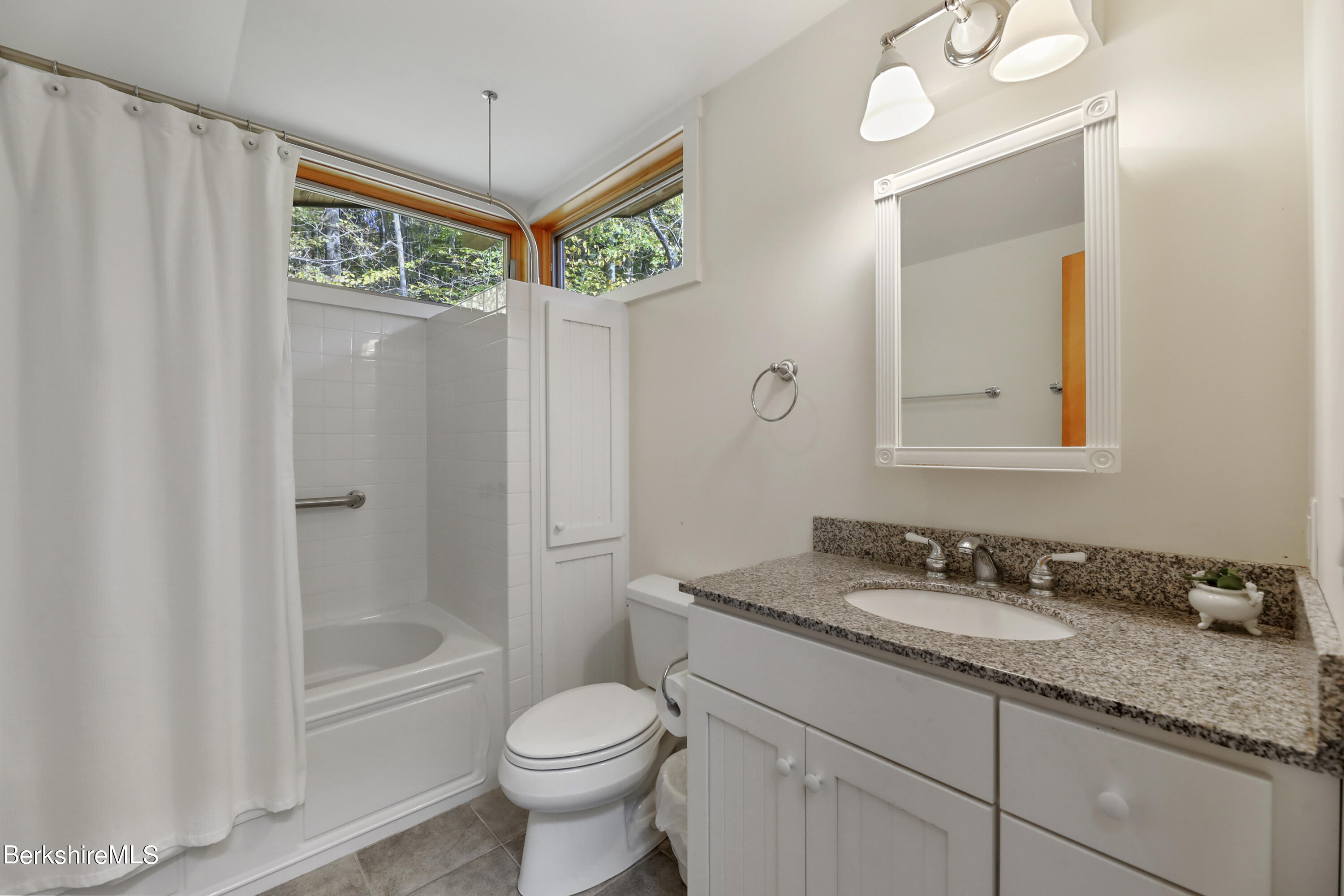 494 Dean Hill Road Richmond, MA 01254 - Photo 34 of 54 a bathroom with a granite countertop sink toilet and shower