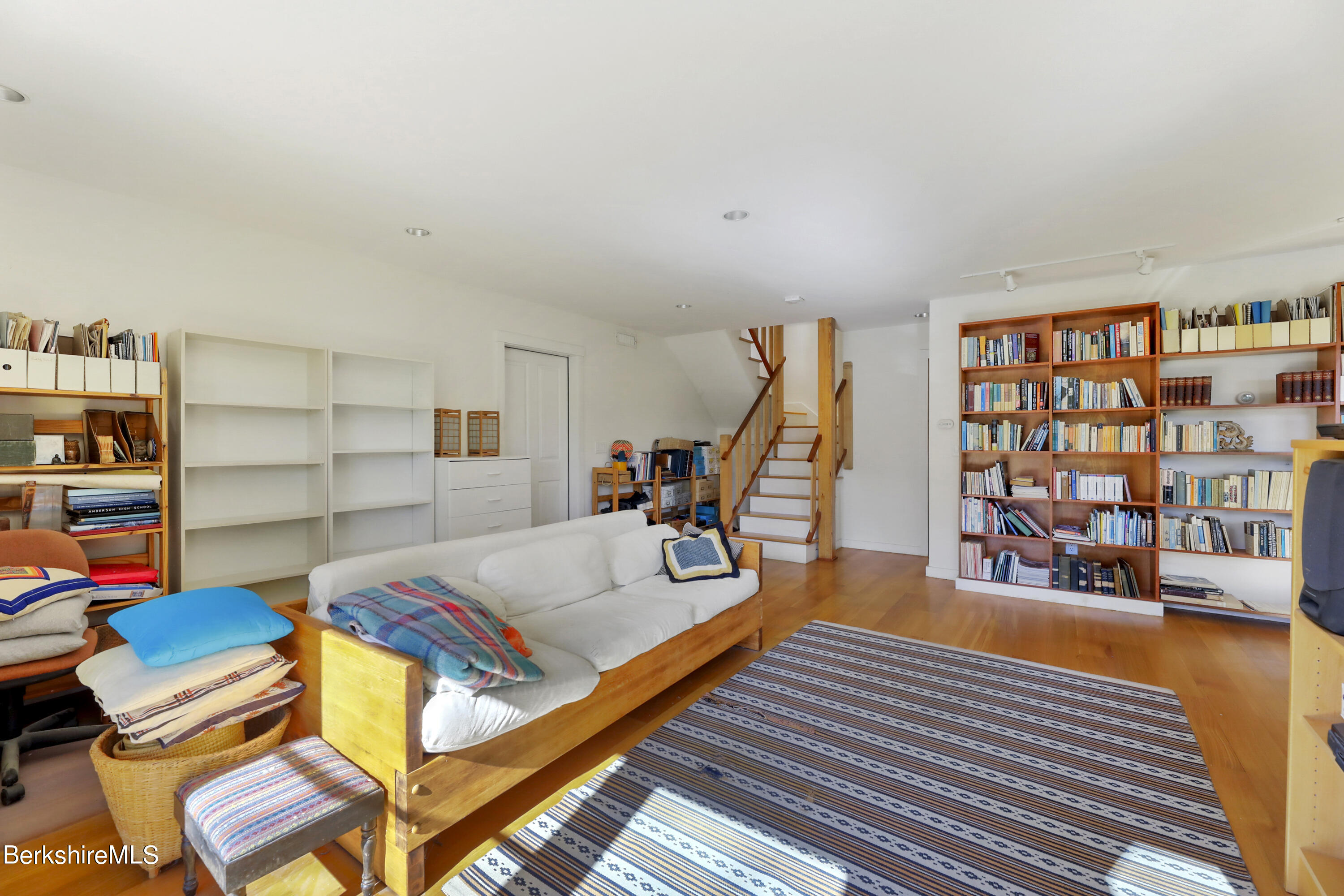 494 Dean Hill Road Richmond, MA 01254 - Photo 38 of 54 a living room with furniture and a book shelf