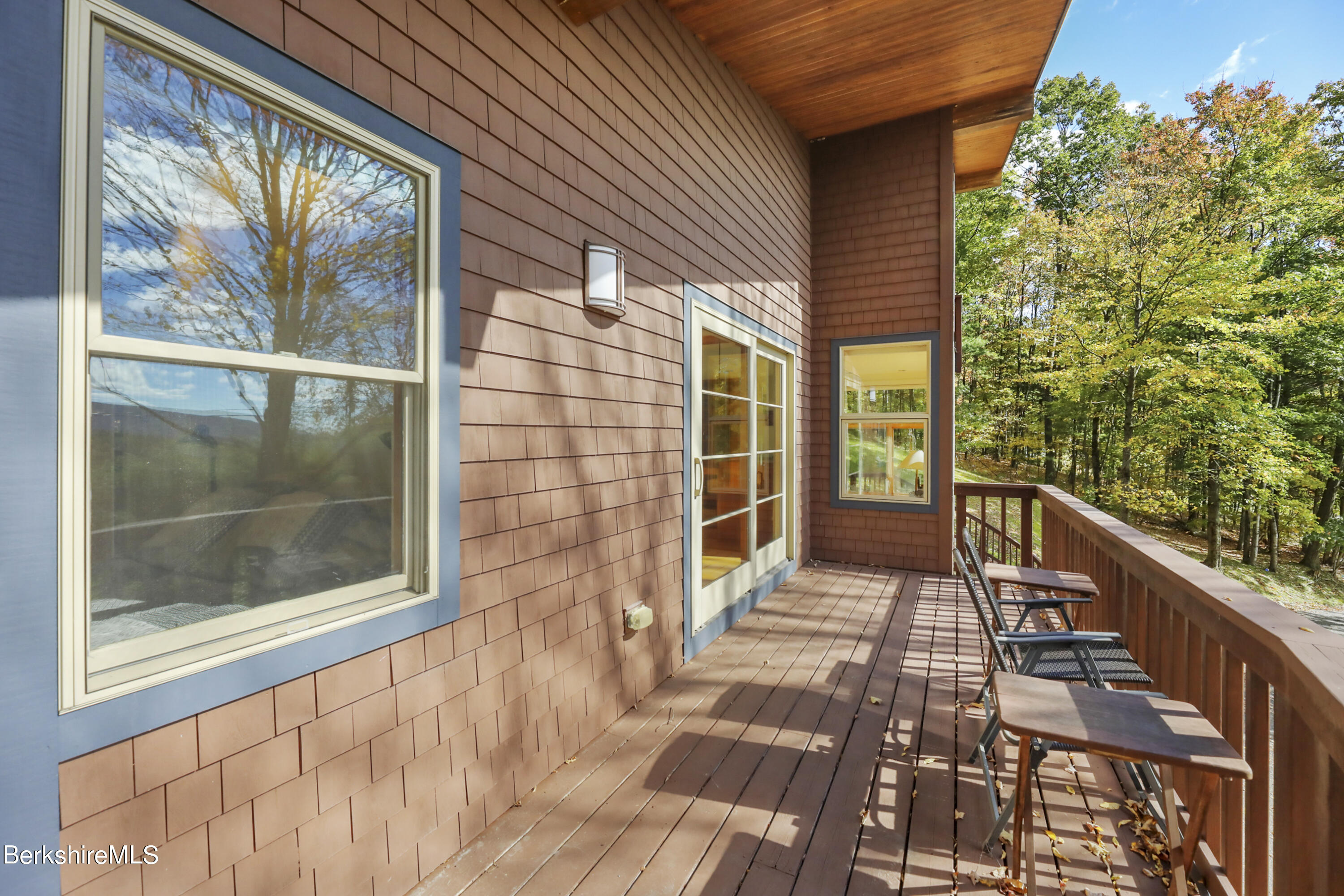 494 Dean Hill Road Richmond, MA 01254 - Photo 40 of 54 a view of a balcony with a potted plant