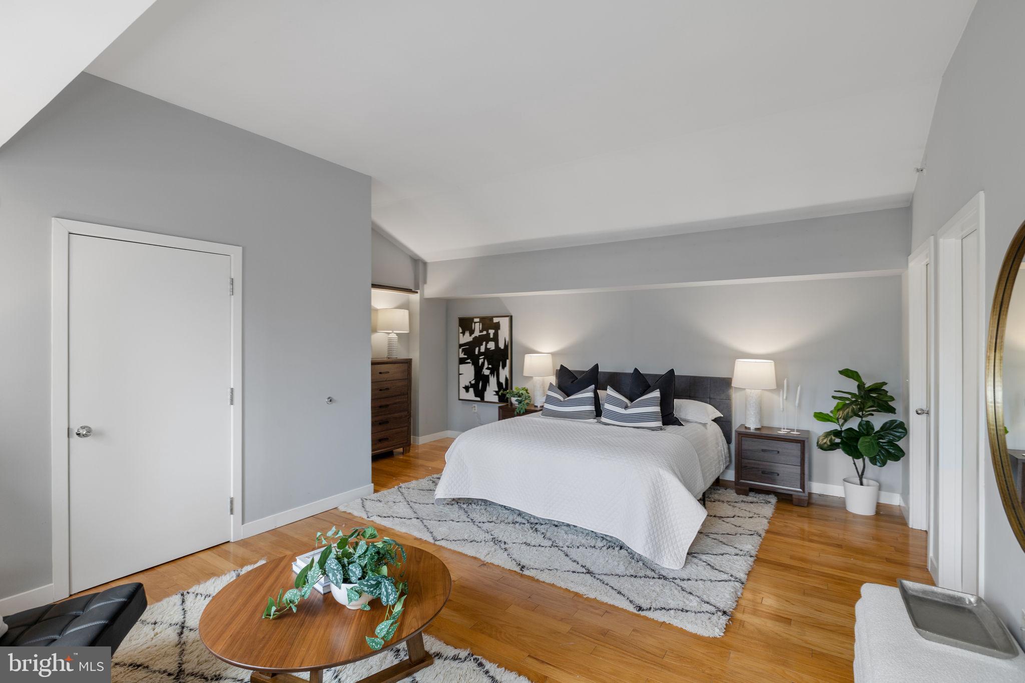 1900 Hamilton Street, Unit D19 Philadelphia, PA 19130 - Photo 14 of 41 a bedroom with a bed and a couch