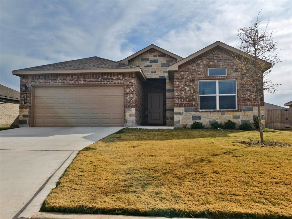 2401 Continental Avenue Abilene, TX 79601 - Photo 1 of 5 a front view of a house with garden