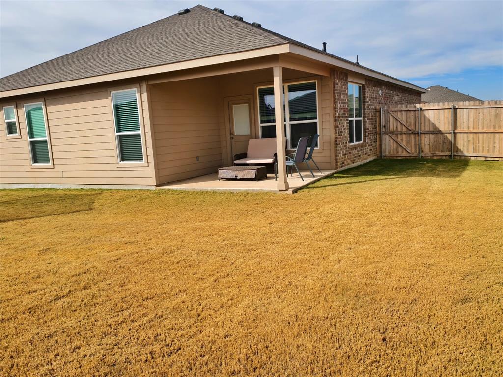 2401 Continental Avenue Abilene, TX 79601 - Photo 4 of 5 a view of a house with a backyard
